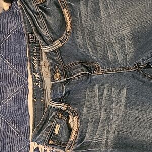 Distressed jeans.